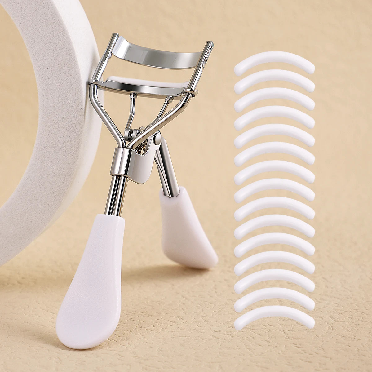Stainless Steel Eyelash Curler with 15 Silicone Pads, Portable Lash Curling Tool in Seven Color Options for Everyday Makeup and Travel Beauty Kits