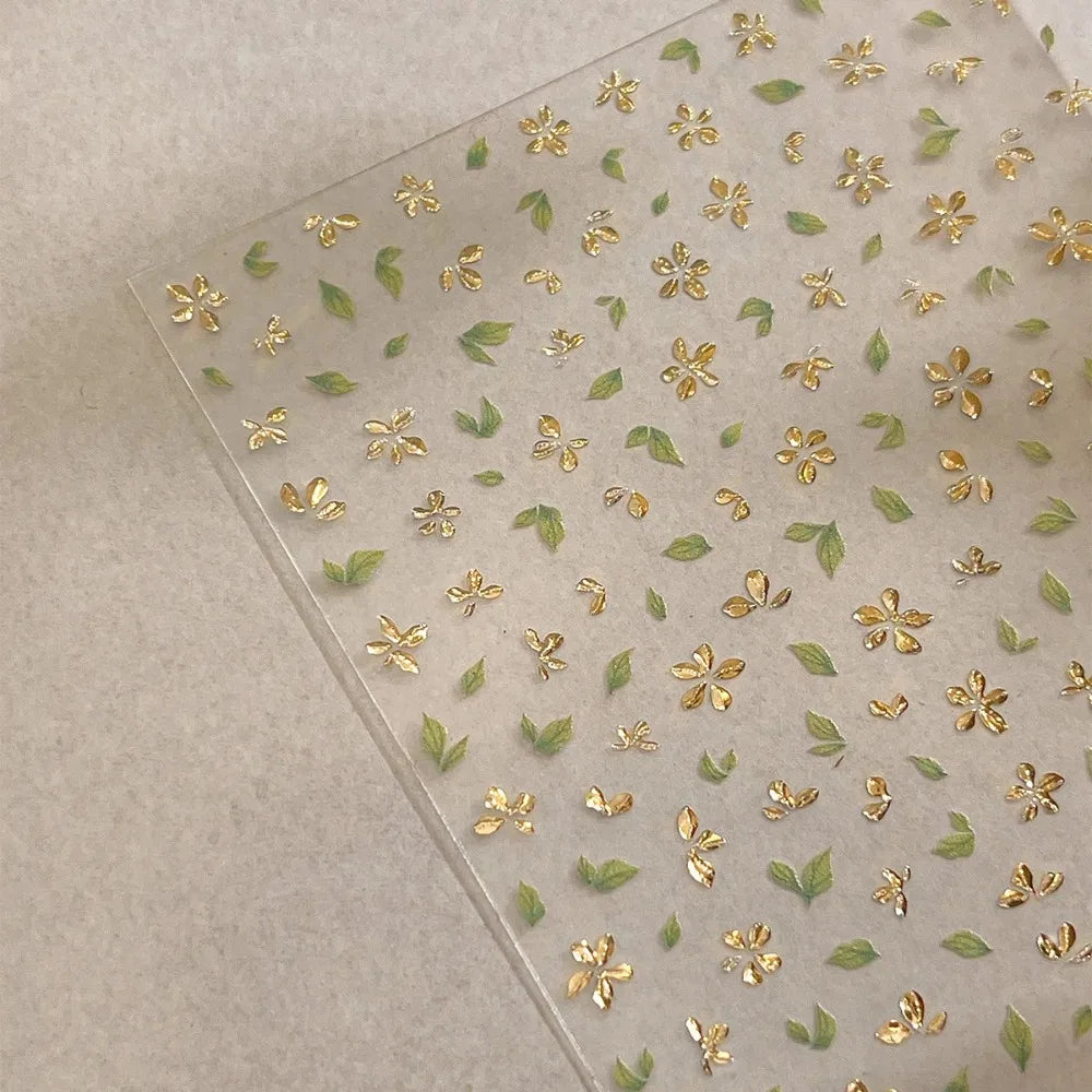 Five-Petal Flower Nail Stickers with Green Leaf and Gold-Tone Details, 3D Adhesive Blossom Decals for Spring Nail Art and Creative DIY Manicures