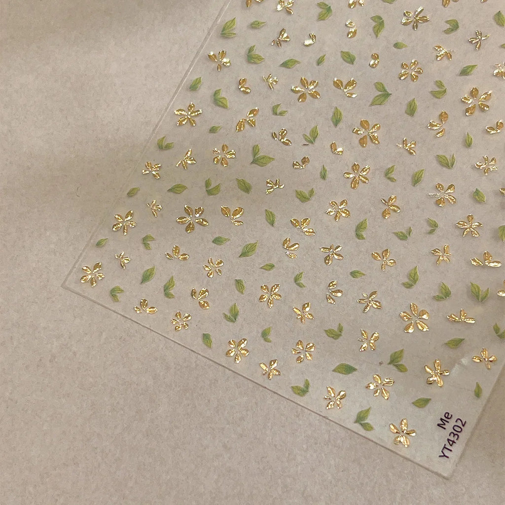 Five-Petal Flower Nail Stickers with Green Leaf and Gold-Tone Details, 3D Adhesive Blossom Decals for Spring Nail Art and Creative DIY Manicures