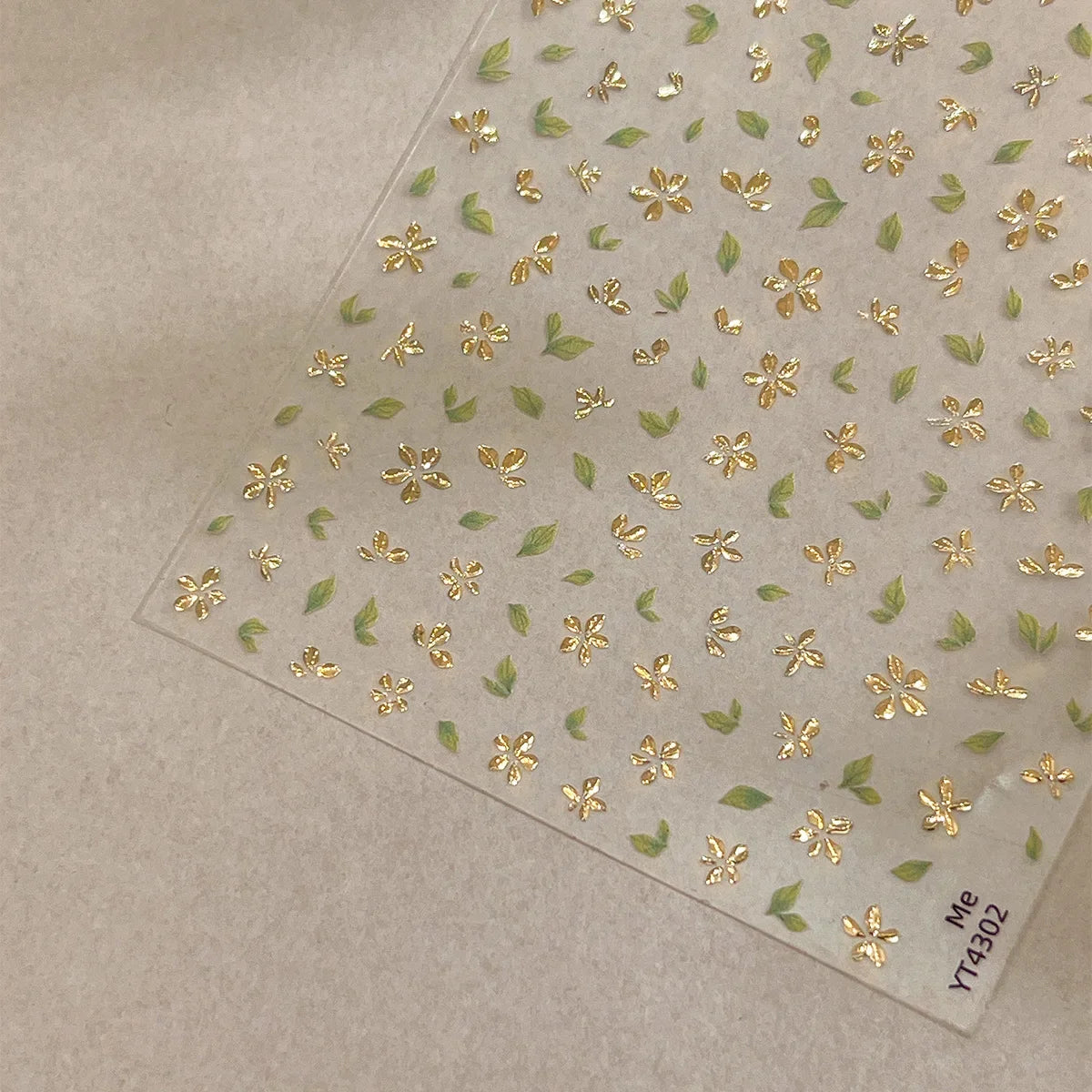 Five-Petal Flower Nail Stickers with Green Leaf and Gold-Tone Details, 3D Adhesive Blossom Decals for Spring Nail Art and Creative DIY Manicures