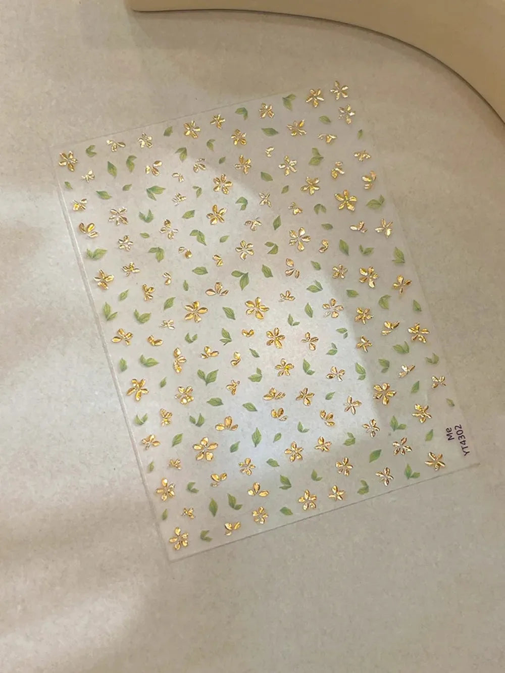 Five-Petal Flower Nail Stickers with Green Leaf and Gold-Tone Details, 3D Adhesive Blossom Decals for Spring Nail Art and Creative DIY Manicures