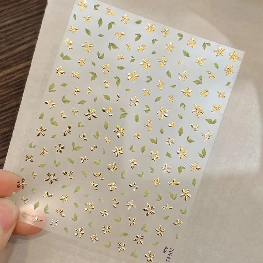Five-Petal Flower Nail Stickers with Green Leaf and Gold-Tone Details, 3D Adhesive Blossom Decals for Spring Nail Art and Creative DIY Manicures