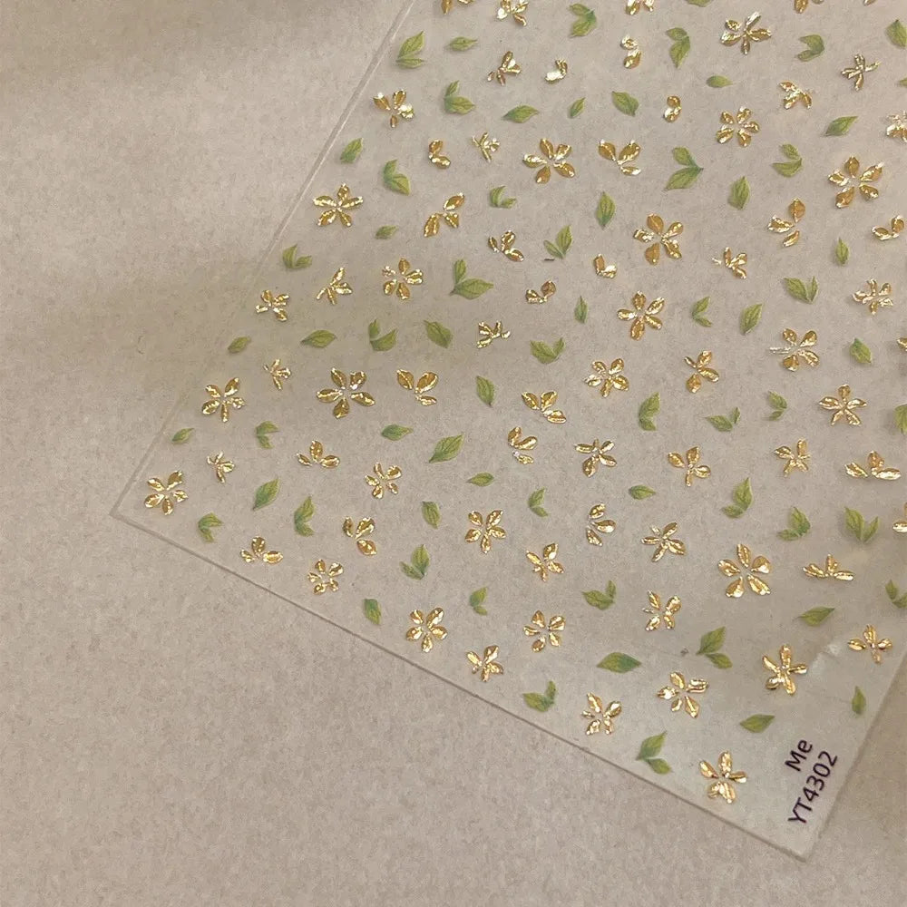 Five-Petal Flower Nail Stickers with Green Leaf and Gold-Tone Details, 3D Adhesive Blossom Decals for Spring Nail Art and Creative DIY Manicures