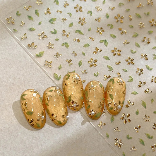 Five-Petal Flower Nail Stickers with Green Leaf and Gold-Tone Details, 3D Adhesive Blossom Decals for Spring Nail Art and Creative DIY Manicures
