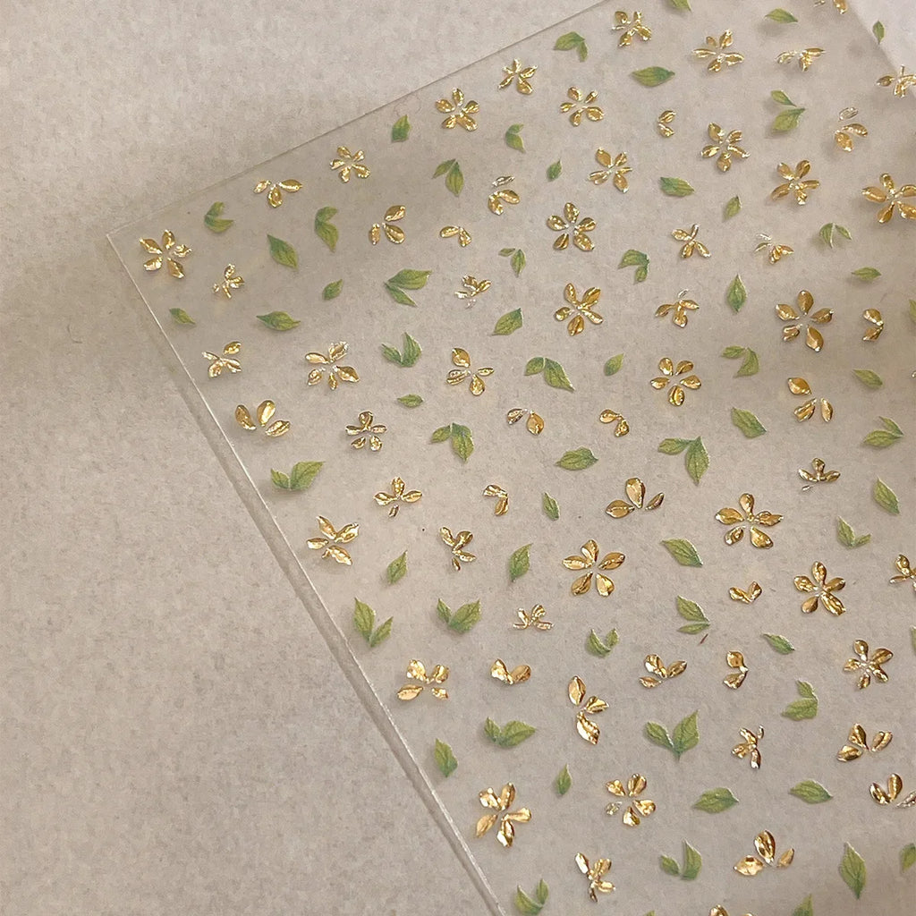 Five-Petal Flower Nail Stickers with Green Leaf and Gold-Tone Details, 3D Adhesive Blossom Decals for Spring Nail Art and Creative DIY Manicures