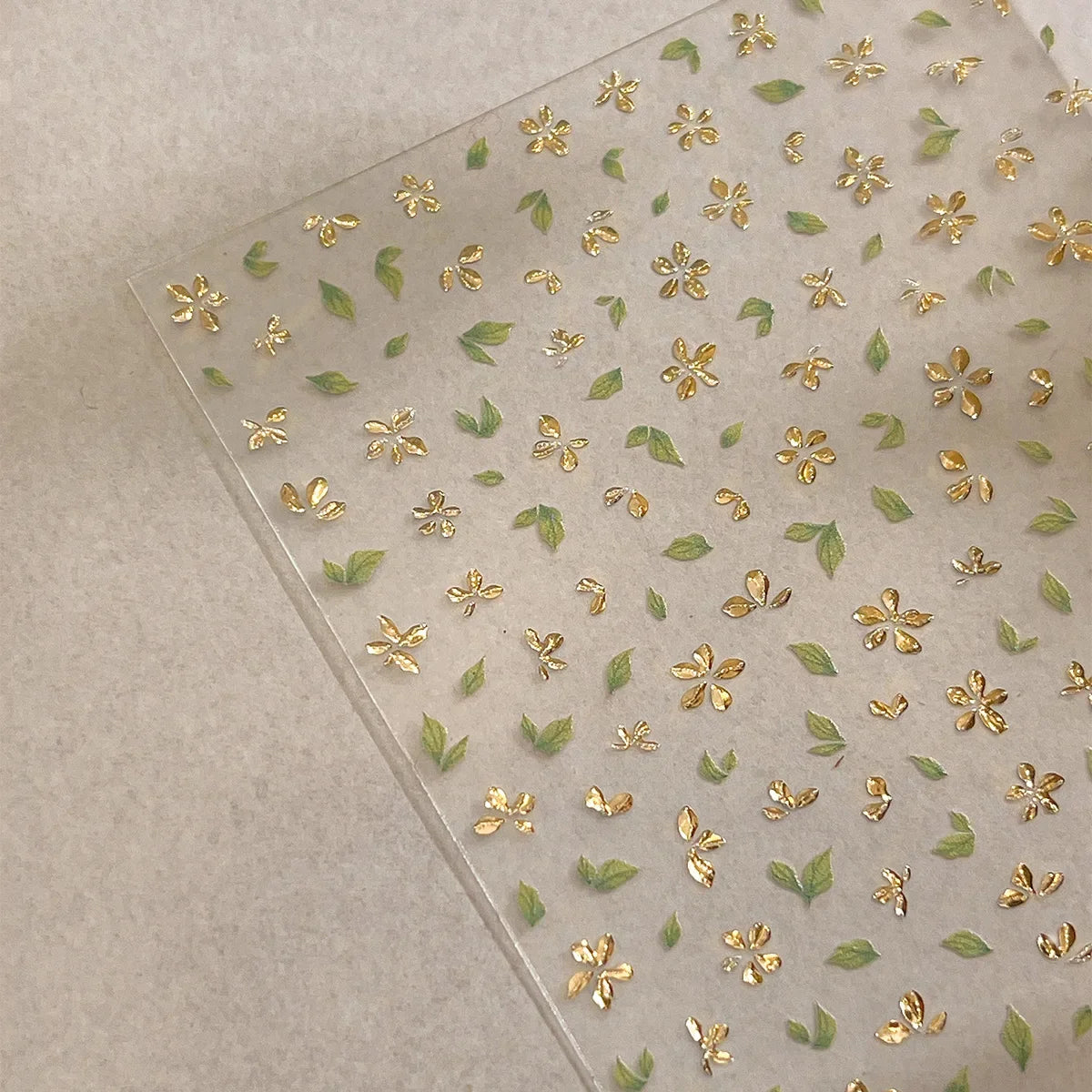 Five-Petal Flower Nail Stickers with Green Leaf and Gold-Tone Details, 3D Adhesive Blossom Decals for Spring Nail Art and Creative DIY Manicures