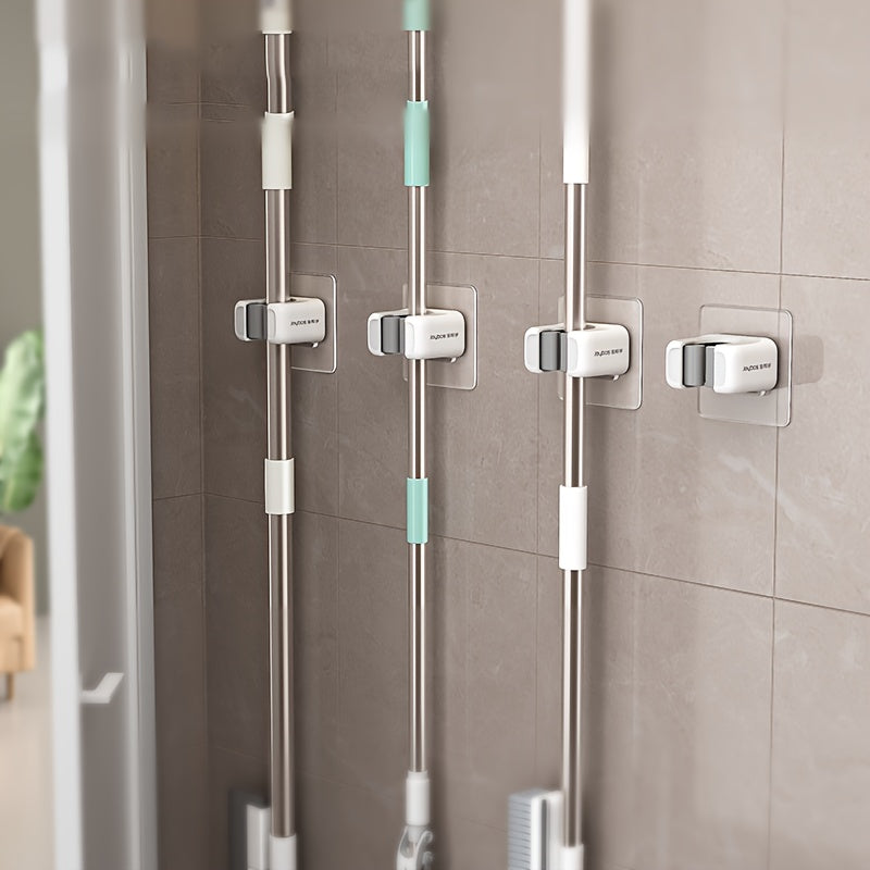 Mop and Broom Holder Clips in White, 4-Piece Self-Adhesive No-Drill Plastic Wall Organizer for Vertical Cleaning Tool Storage in Kitchens and Utility Rooms